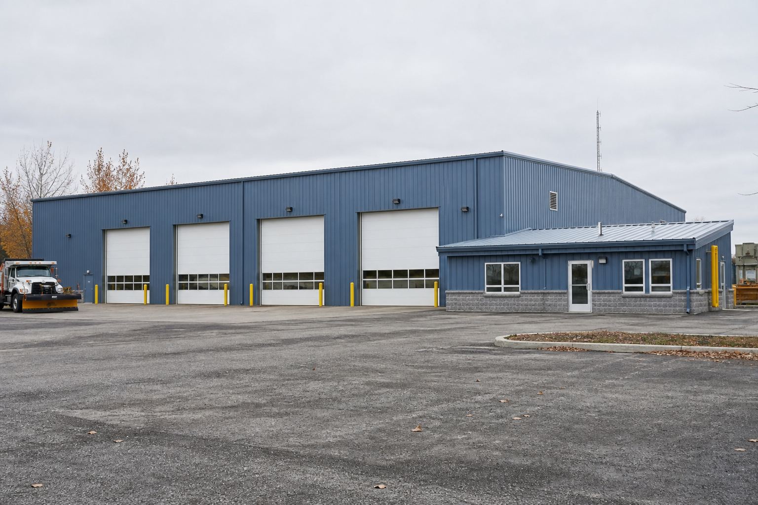 Finished steel shop with overhead doors and an attached office