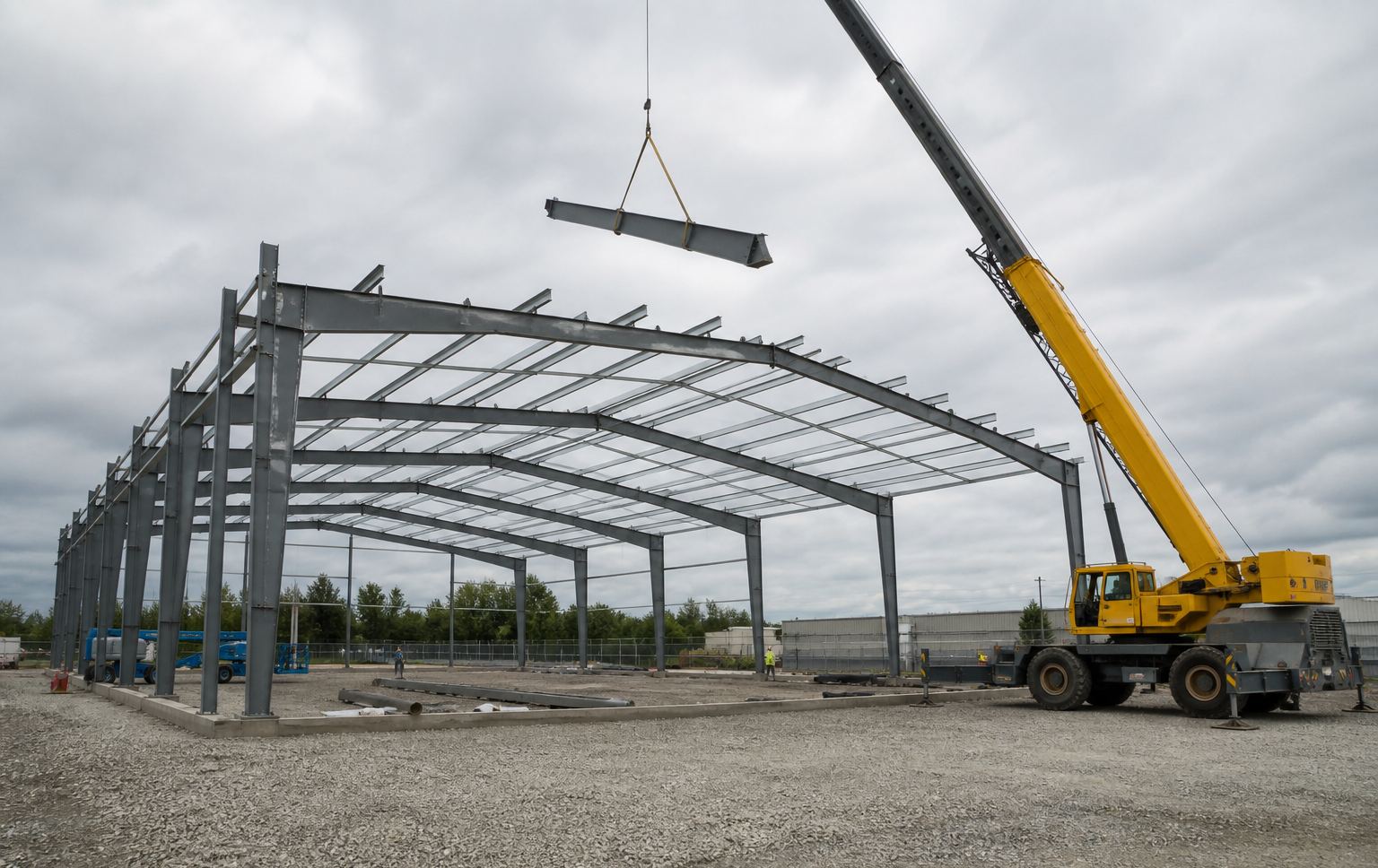 Crane setting a steel rafter on an Ontario job site